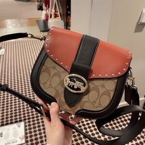 Coach Georgie Saddle Bag In Colorblock Signature Canvas With Rivets